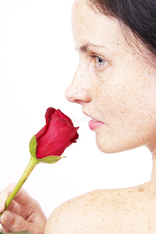 Beautiful brunette woman with a rose