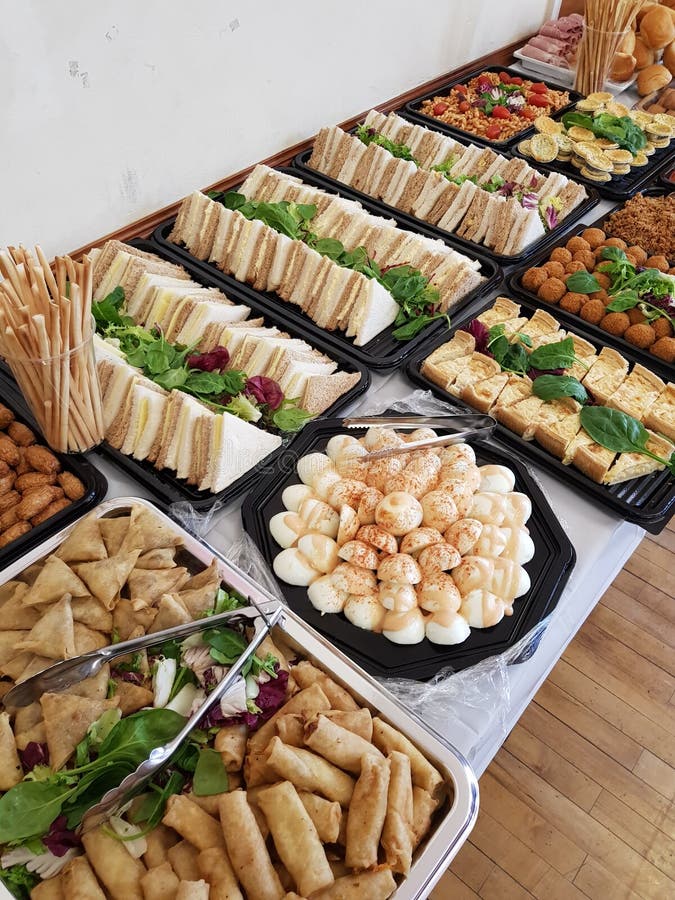 Buffet Spread Including Grilled Reuben Sandwiches Under A Heater Stock