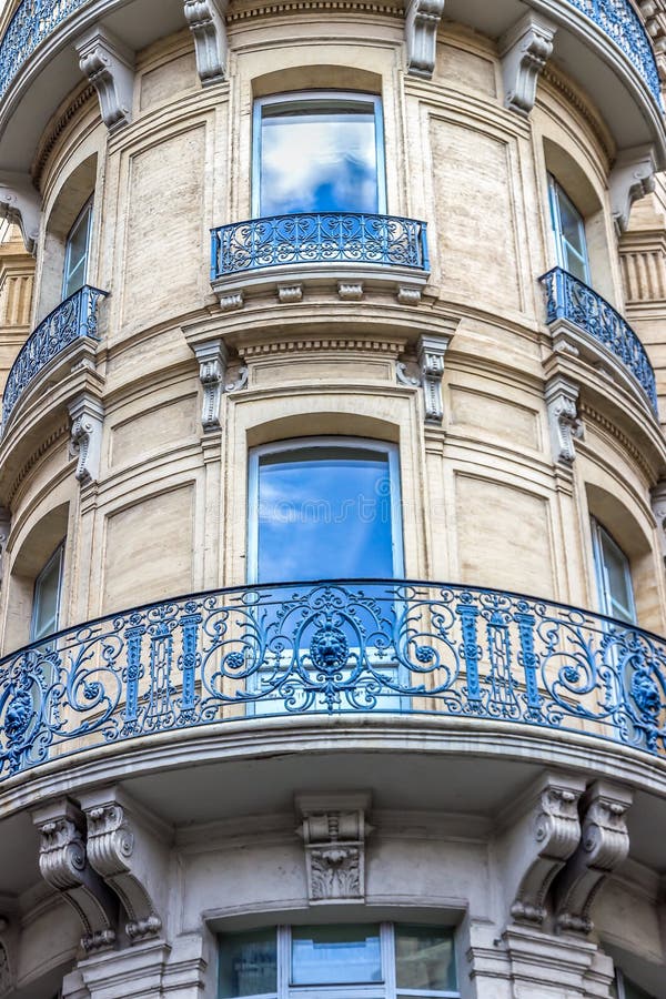 Beautiful building details. Ornate facade with iron balconies. Toulouse, France