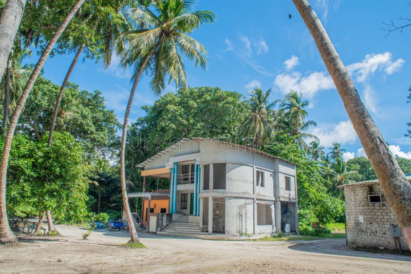 Beautiful building on the street with palm trees in the village at tropical island stock images Beautiful building on the street with palm trees in the village at tropical island stock images