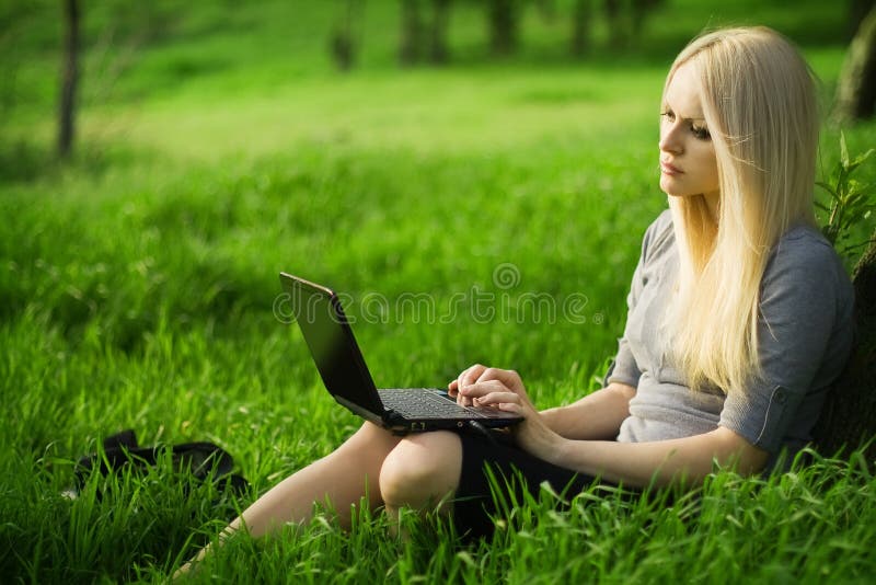 Beautiful business woman with the laptop