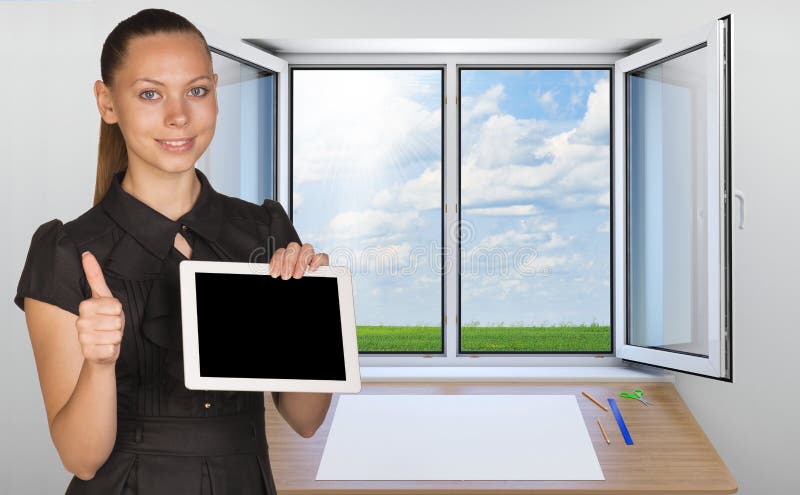 Beautiful businesswoman holding blank tablet PC stock photography Beautiful businesswoman holding blank tablet PC stock photography