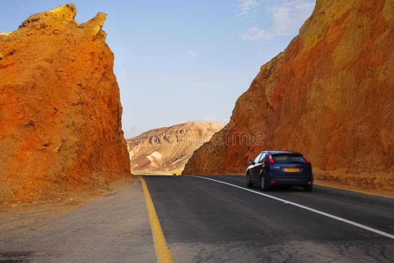 The beautiful car on highway in stone desert