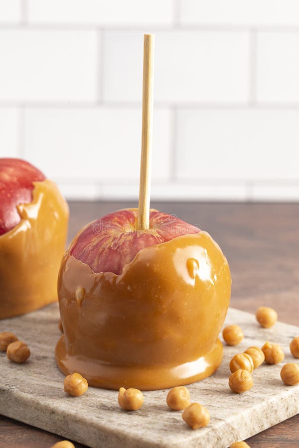 Caramel Apples on a Rustic Kitchen Ready for Fall Stock Photo