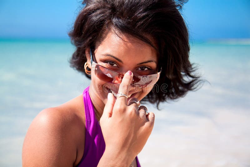 Beautiful caribbean brunette with sunglasses