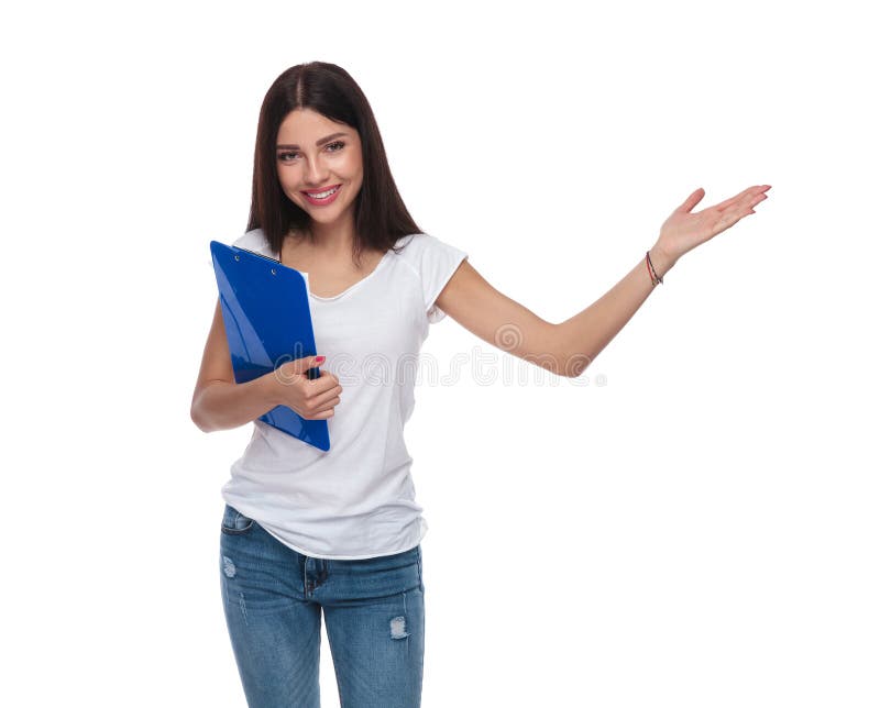 Beautiful casual woman holds blue folder and presents to side royalty free stock images Beautiful casual woman holds blue folder and presents to side royalty free stock images