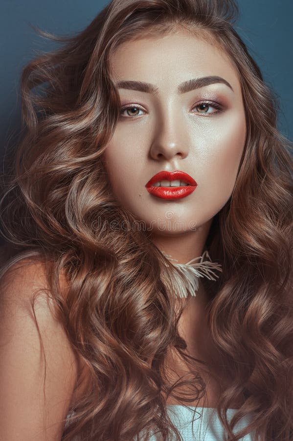 Beautiful caucasian girl with curly long hair and luxury makeup stock photography Beautiful caucasian girl with curly long hair and luxury makeup stock photography