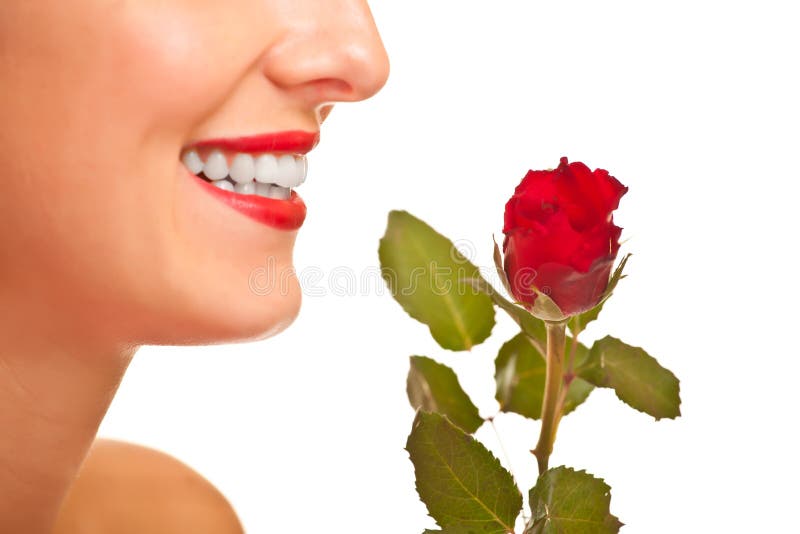 Beautiful caucasian woman with red roses isolated