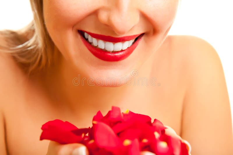 Beautiful caucasian woman with red roses isolated