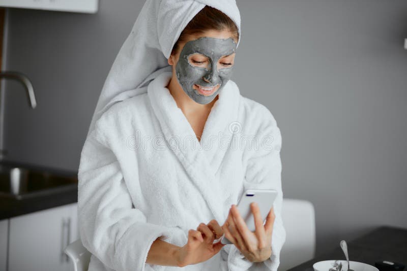 Beautiful Caucasian Woman in White Bathrobe and Towel Use Beauty Masks ...