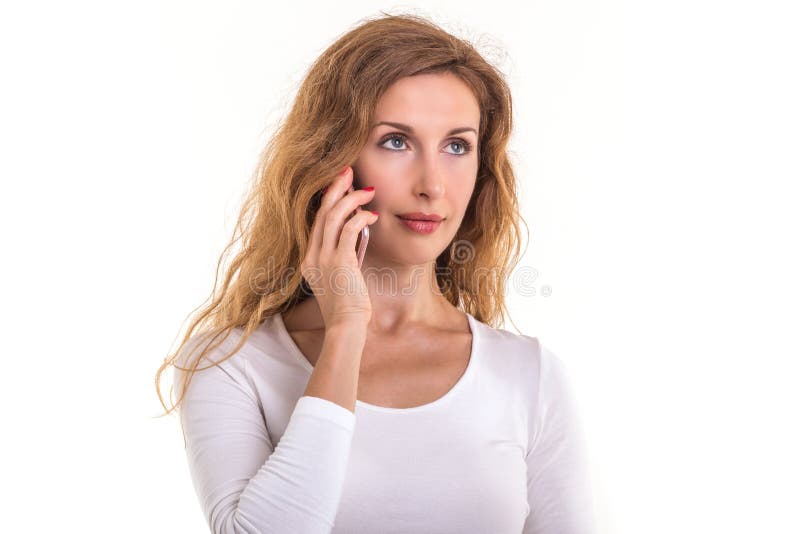 Beautiful caucasian woman in white t-shirt using smartphone. Stu stock photography Beautiful caucasian woman in white t-shirt using smartphone. Stu stock photography