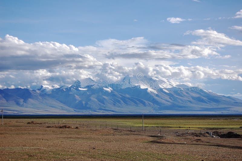 A beautiful and charming snow mountains in the distance royalty free stock photo