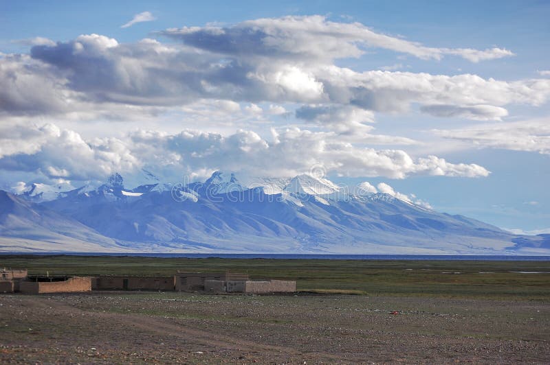 A beautiful and charming snow mountains in the distance royalty free stock images