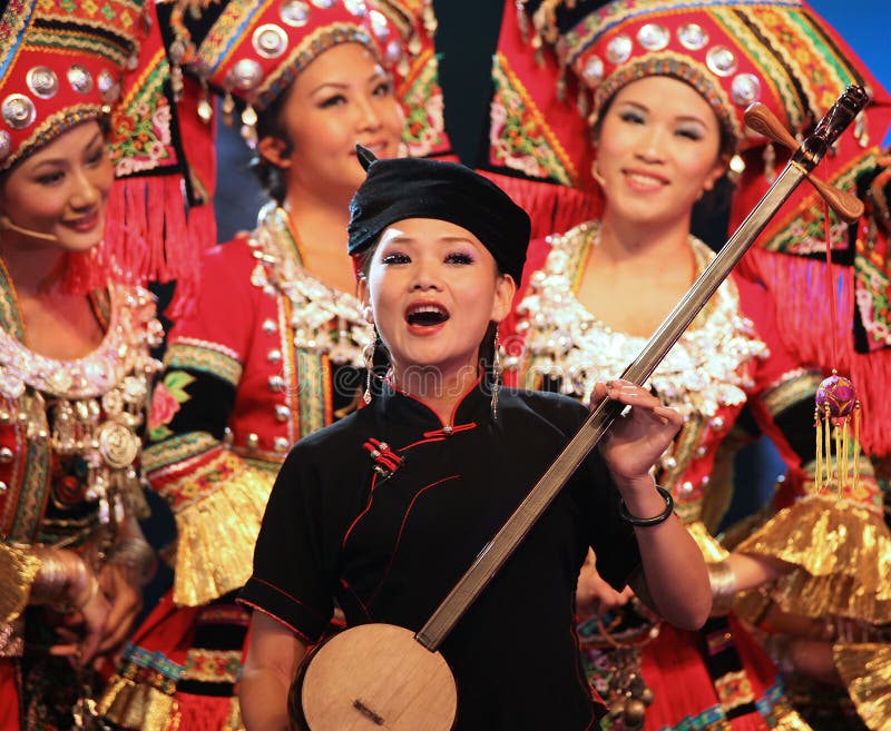 SHANGHAI - AUGUST 4: Artists perform on stage during Folk Art and Intangible Cultural Heritage Show as a part of the Guangxi Cultural Week on August 4, 2010 in Shanghai, China. SHANGHAI - AUGUST 4: Artists perform on stage during Folk Art and Intangible Cultural Heritage Show as a part of the Guangxi Cultural Week on August 4, 2010 in Shanghai, China