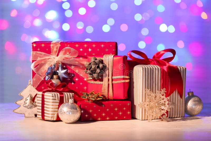 Beautiful Christmas Gift Boxes with Decorations on Table Against ...