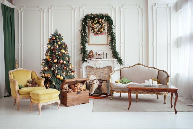 Beautiful Christmas interior. New year decoration. Living room with fireplace