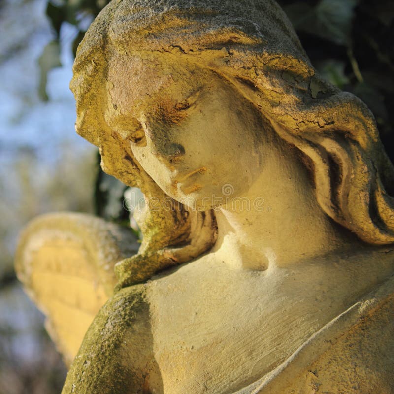 Beautiful close up af a face angel stone sculpture with a sweet royalty free stock photography Beautiful close up af a face angel stone sculpture with a sweet royalty free stock photography
