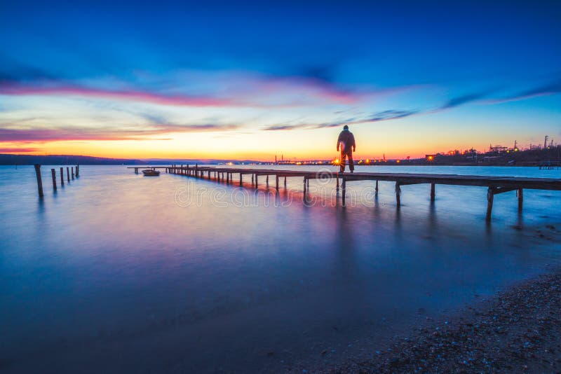 Beautiful cloudscape over the lake and blured boat stock images