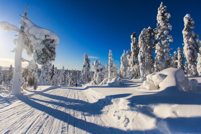 Beautiful cold mountain view of ski resort, sunny winter day wit. H slope, piste and ski lift, Lapland, blue sky royalty free stock photo Beautiful cold mountain view of ski resort, sunny winter day wit. H slope, piste and ski lift, Lapland, blue sky royalty free stock photo