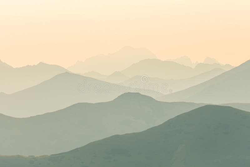 A beautiful, colorful, abstract mountain scenery in sunrise. Minimalist landscape of mountains in morning in blue tones.