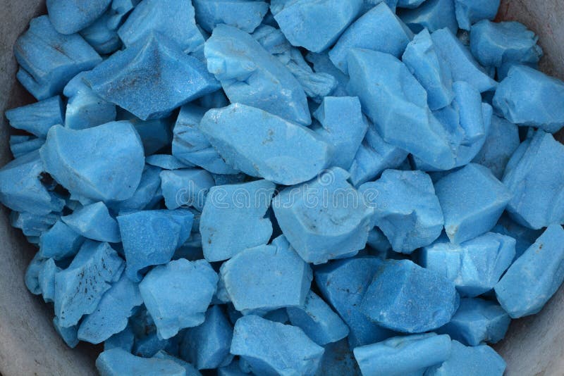 Beautiful colorful blue stones in clay vessels background. Beautiful shiny blue colorful stones in clay vessels close up royalty free stock image Beautiful colorful blue stones in clay vessels background. Beautiful shiny blue colorful stones in clay vessels close up royalty free stock image