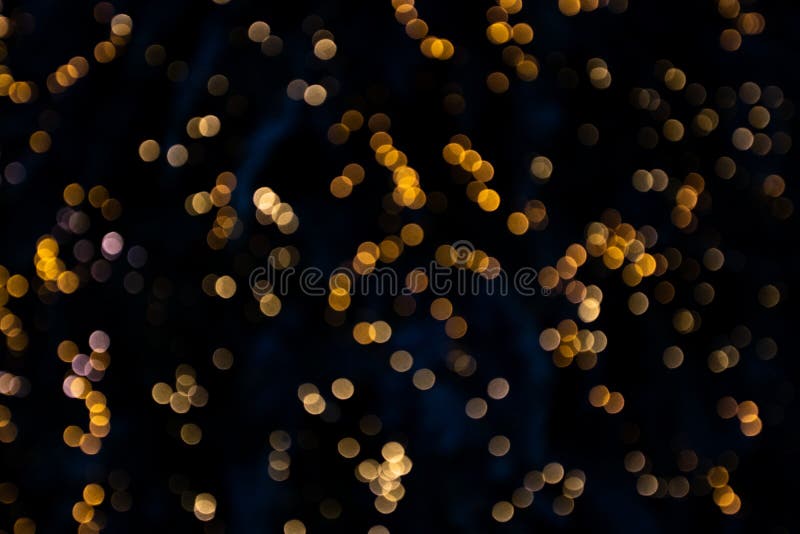 Beautiful and colorful bokeh lights on a black background - blurry backgrounds, lights at night stock image