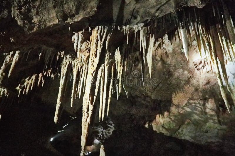 Beautiful colorful and illuminated cave with stalactites and stalagmites royalty free stock photos
