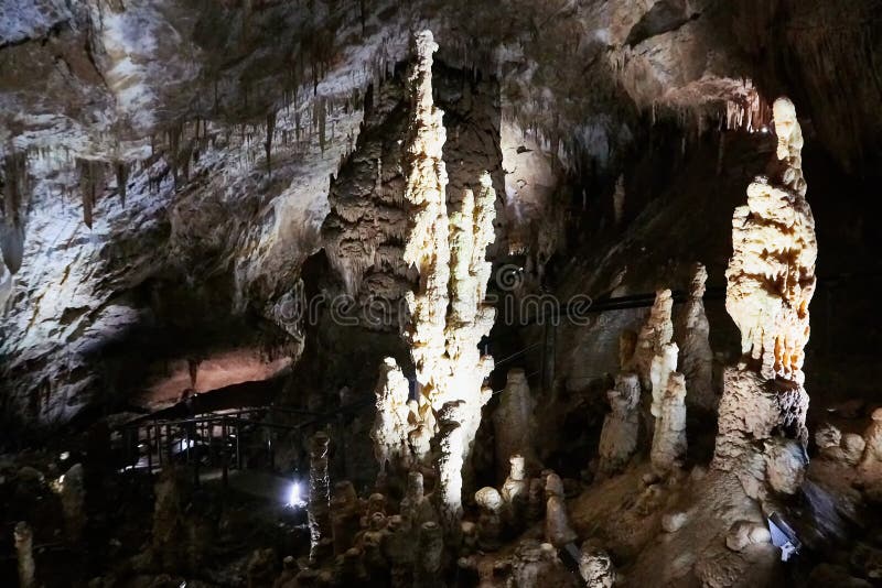Beautiful colorful and illuminated cave with stalactites and stalagmites royalty free stock photos