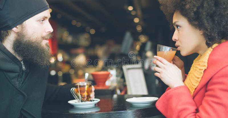 Beautiful couple enjoying tea in a restaurant royalty free stock image Beautiful couple enjoying tea in a restaurant royalty free stock image