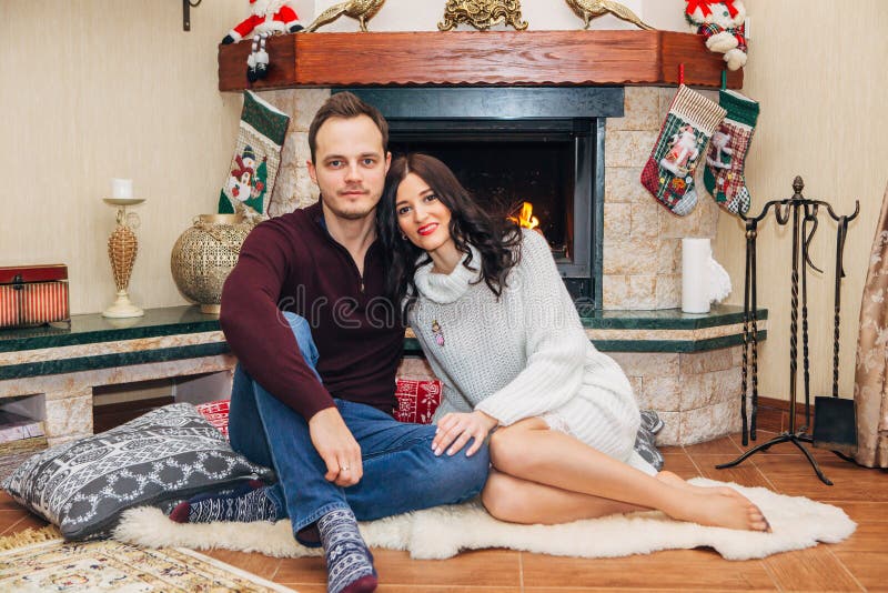 Beautiful couple in love near fireplace royalty free stock photos Beautiful couple in love near fireplace royalty free stock photos