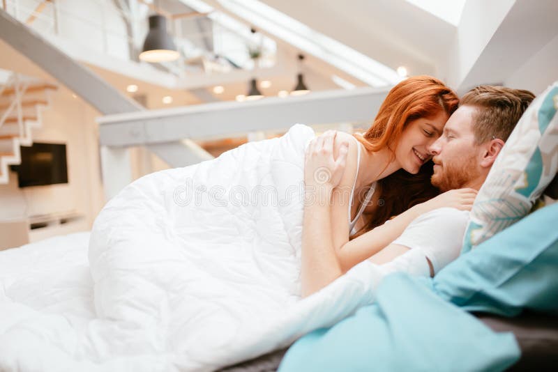 Beautiful Couple Romance in Bed Stock