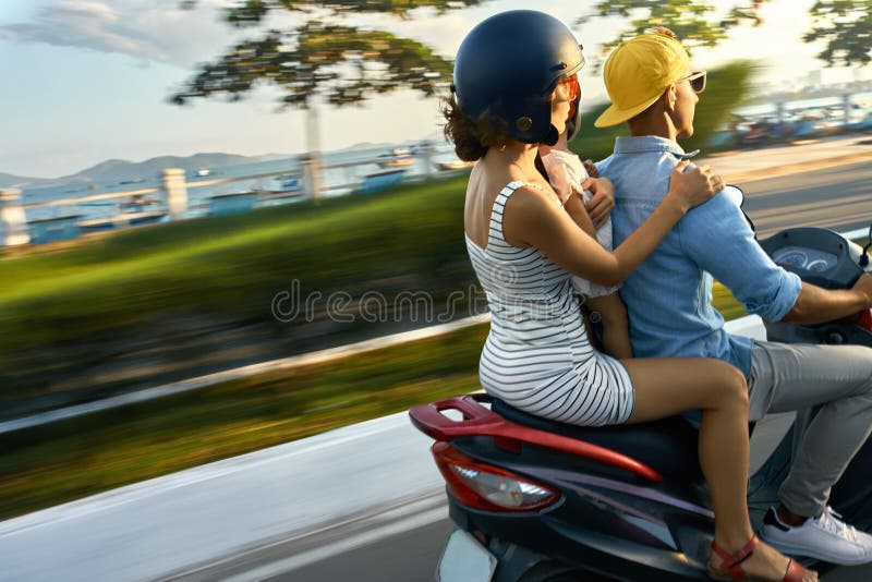 Parents with Their Child Riding Motorcycle on Sunny City Street Stock ...