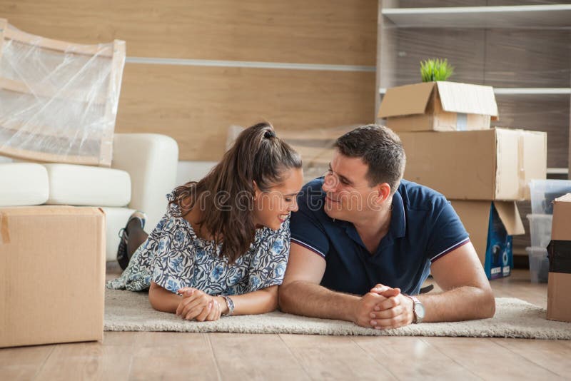 Beautiful Couple In Their New Flat Lying On The Floor Stock Image Image of agreement