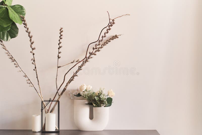 Beautiful curved vase with flowers close-up. Flowers in interior design. Cozy house. stock photo Beautiful curved vase with flowers close-up. Flowers in interior design. Cozy house. stock photo