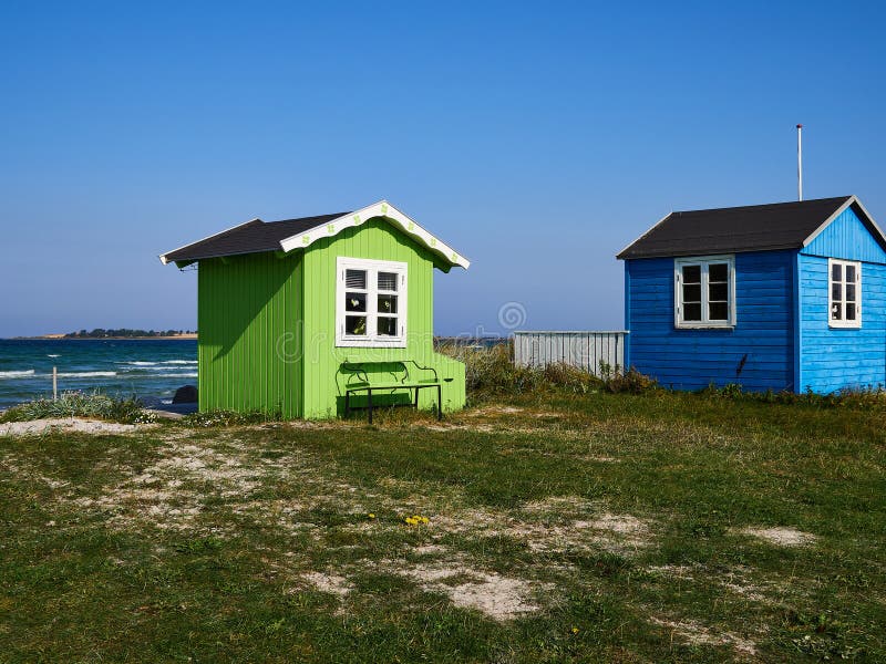 Beautiful cute little wooden beach huts summer houses, painted in lively colors, Aero Island, South Funen, Denmark