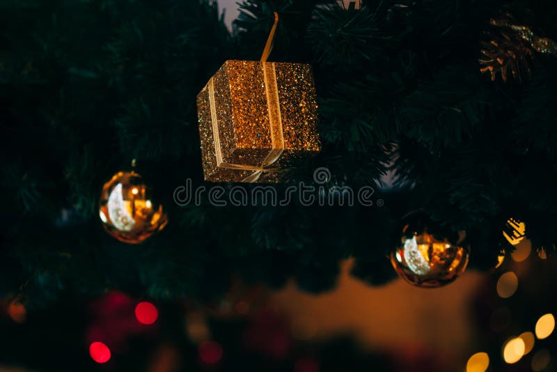 Beautiful decorated Christmas tree background with red gift box and xmas ornaments. royalty free stock photos