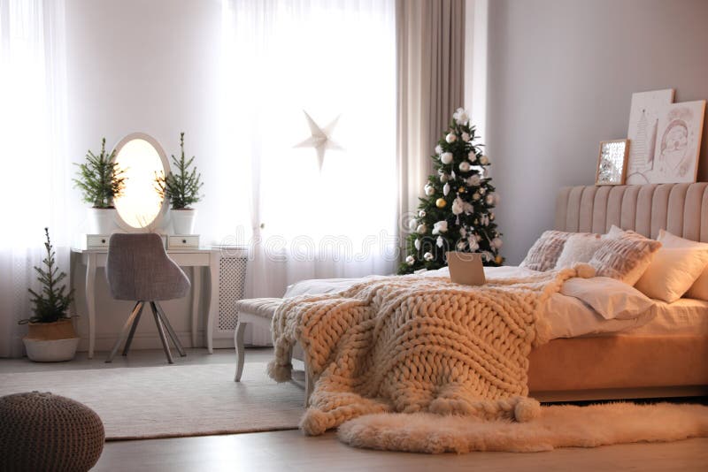 Beautiful Decorated Christmas Tree in Bedroom Interior Stock Image