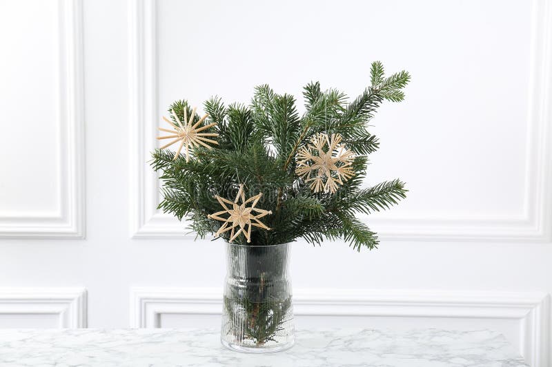 Beautiful decorated fir tree branches on white table. Christmas season stock photos
