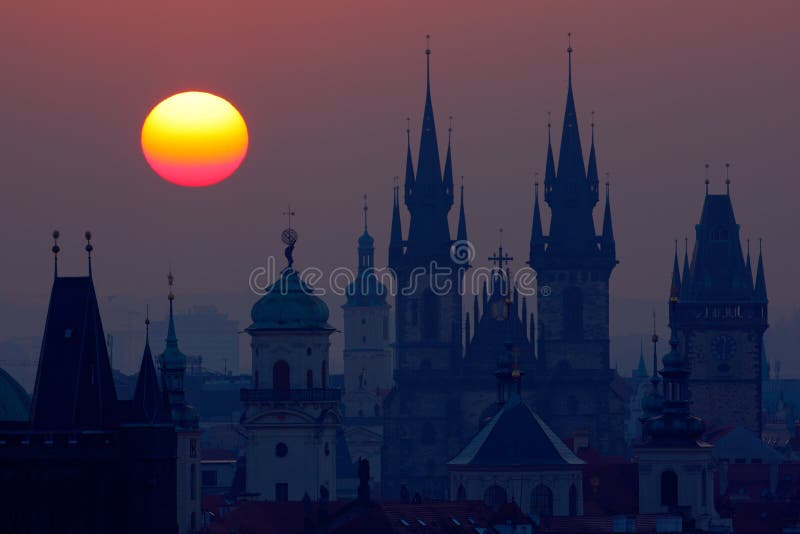 Beautiful detailed sunrise view of Prague church towers. Early morning colours with old town. Twilight in historical city. Magica