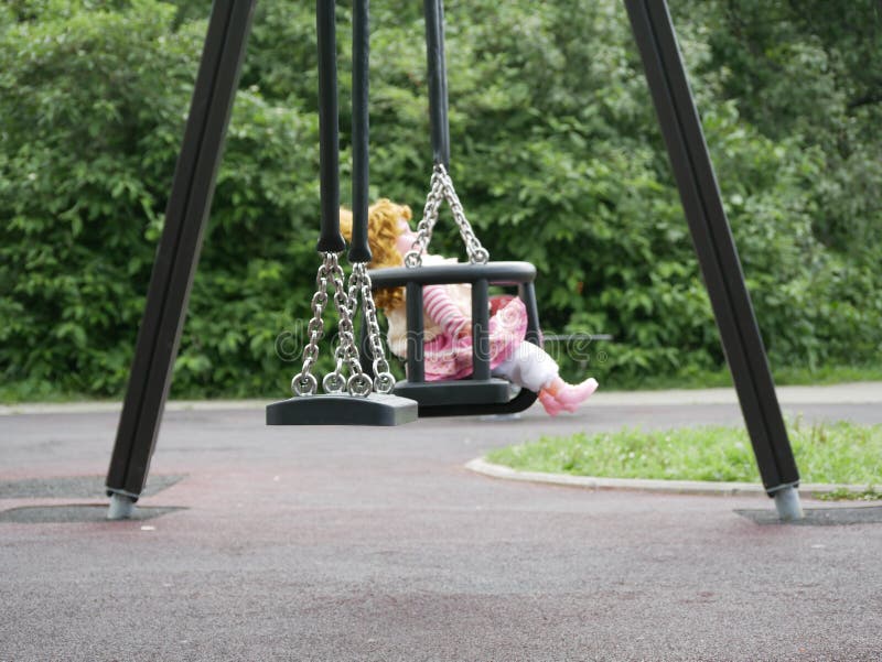 doll on a swing