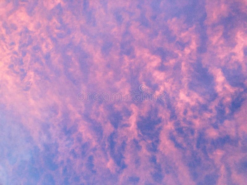 Cotton Candy Pink Clouds in Blue Sky