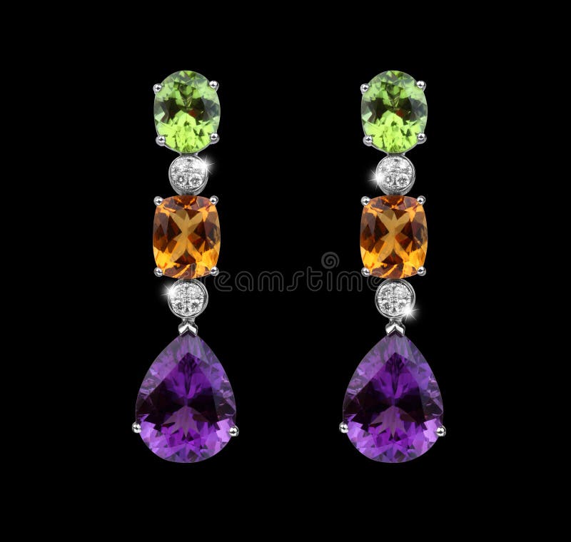 Beautiful Earrings with colorful gems royalty free stock photography