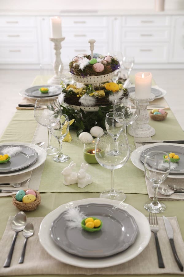 Beautiful Easter Table Setting with Burning Candles Indoors Stock Image