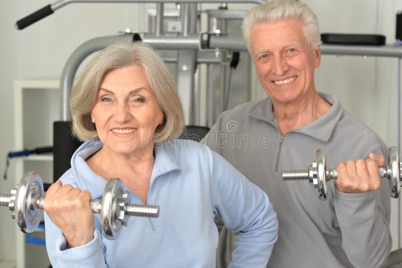 Beautiful elderly couple in a gym. Healthy, lifestyle.