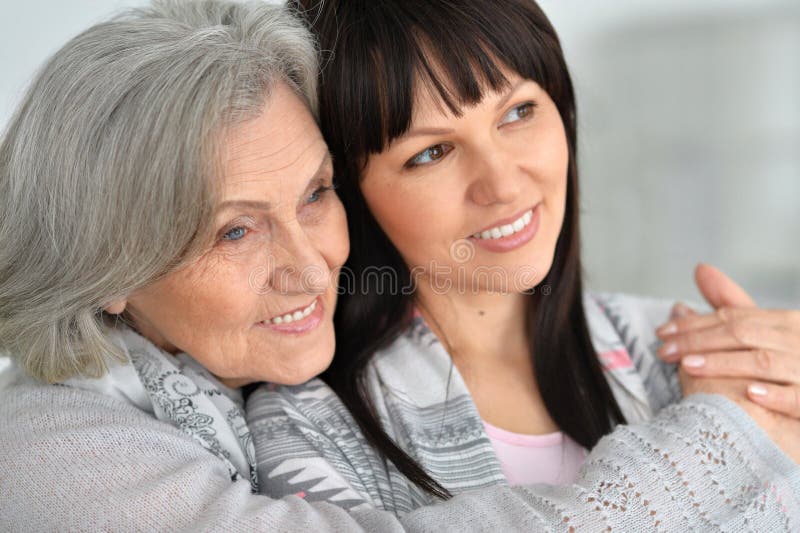 Beautiful elderly mother with an adult daughter. 