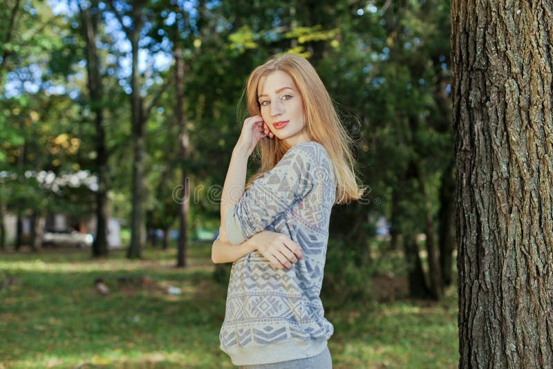 Beautiful Elegant Woman Standing in a Park in Autumn Stock Photo ...