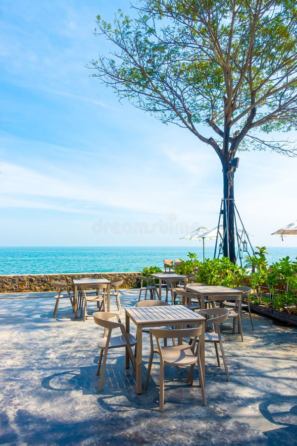 Beautiful and Empty Chair and Umbrella with Swimming Pool and Sea Beach  Background Stock Image - Image of tourist, luxury: 187722521