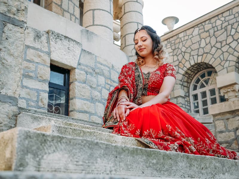 Beautiful Indian bride in traditional wedding dress and posing, Stock  Photo, Picture And Royalty Free Image. Pic. PNT-PIRF-20121217-JH2261 |  agefotostock