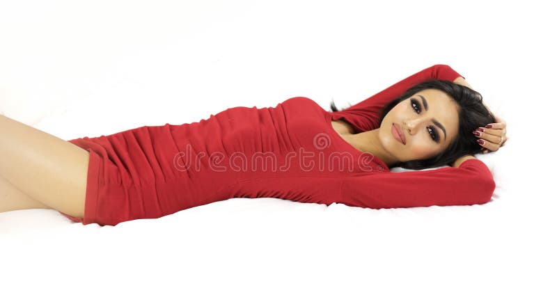 Beautiful exotic woman wearing red dress