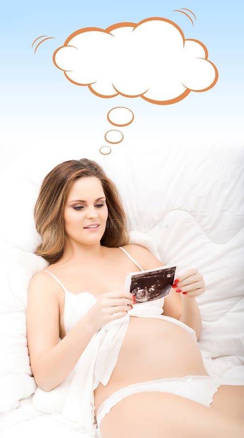 Beautiful expectant woman watching x-ray pictures stock photography Beautiful expectant woman watching x-ray pictures stock photography